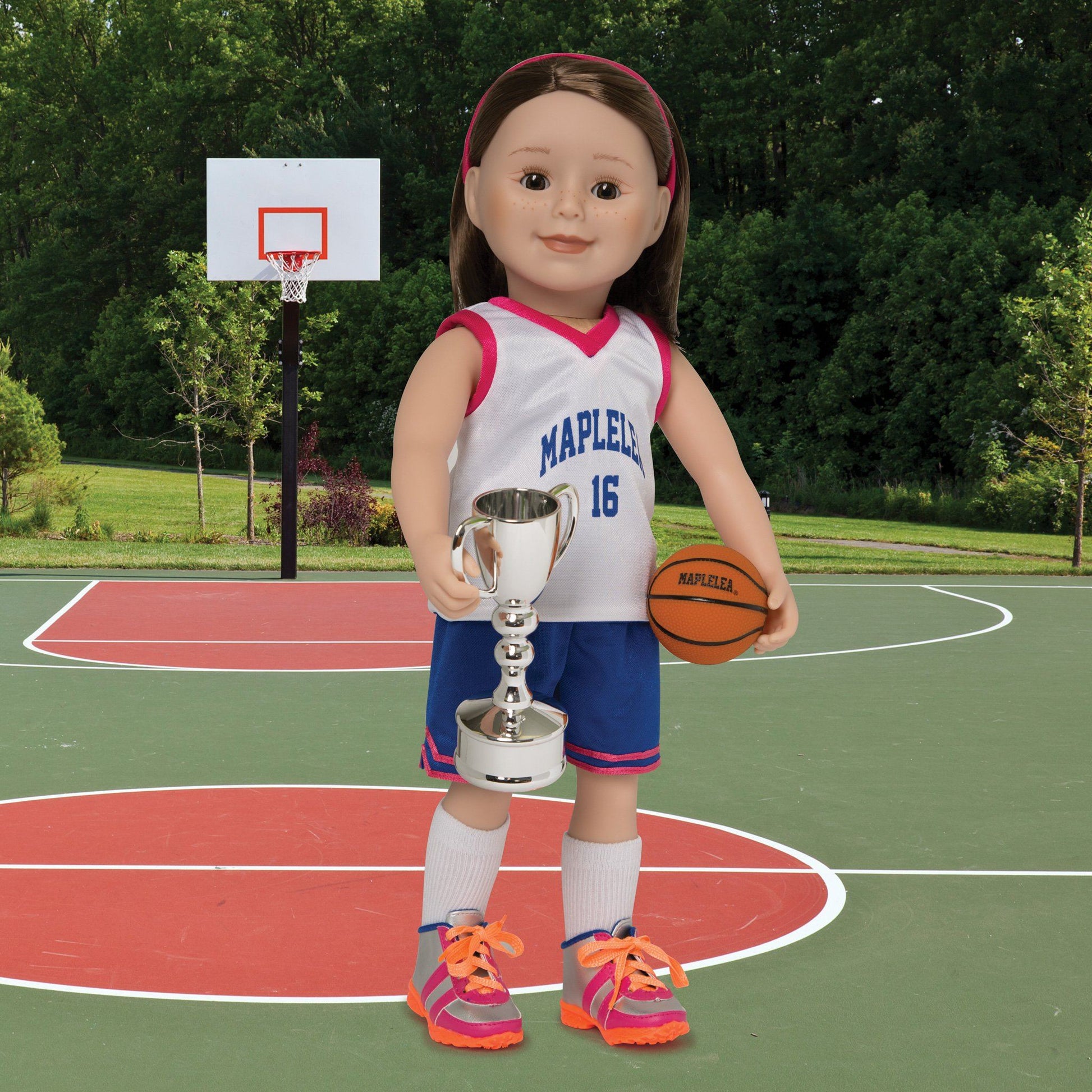 Winner's Circle silver trophy shown on 18-inch doll holding KM91 slam dunk basketball.