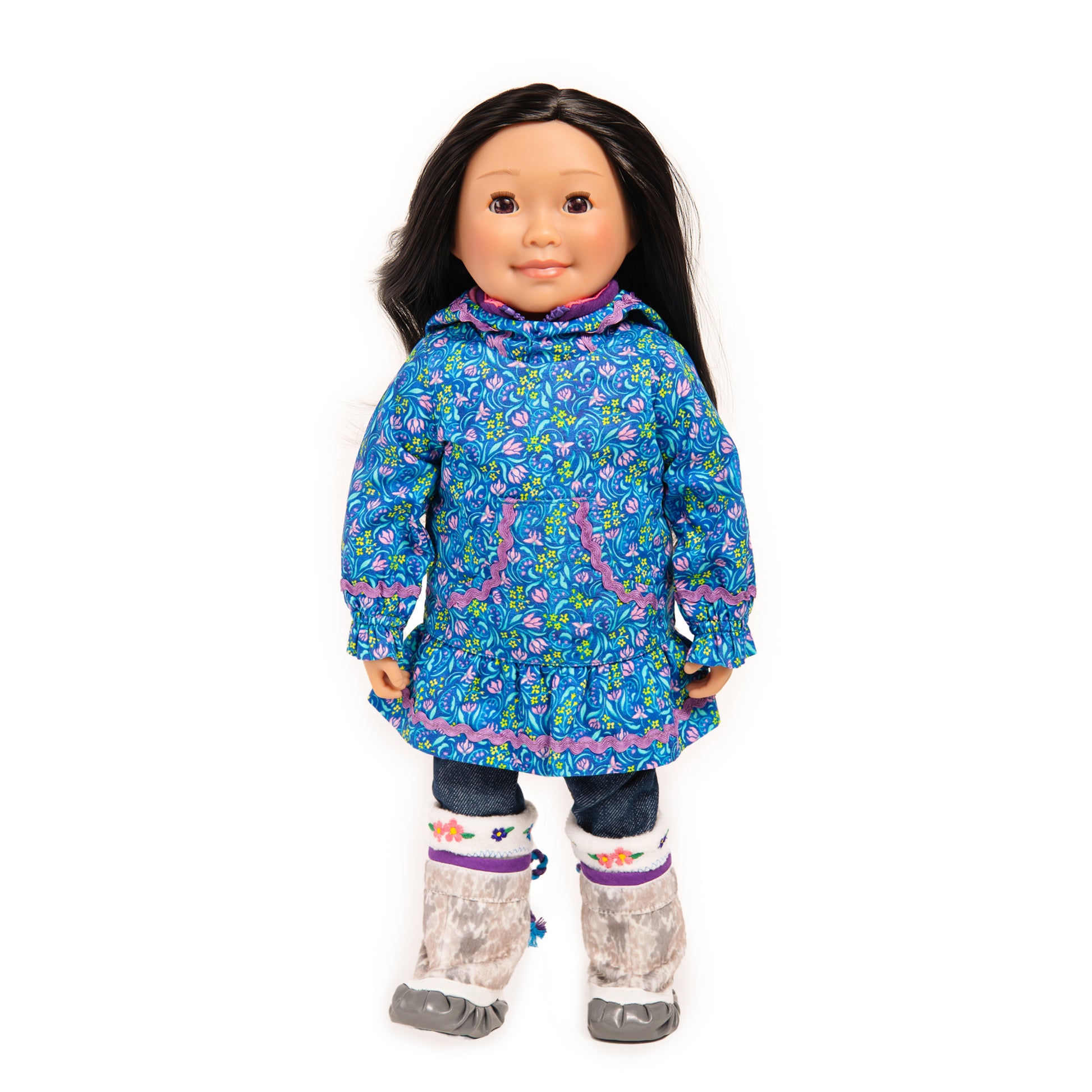 Northern doll wearing traditional Inuit garment kuspuk with sealskin boots.