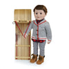 Boy doll in buffalo plaid shirt grey pants and cardigan lace up boots holding a toboggan
