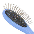 close up of maplelea metal-bristle hair brush for all 18-inch dolls. 