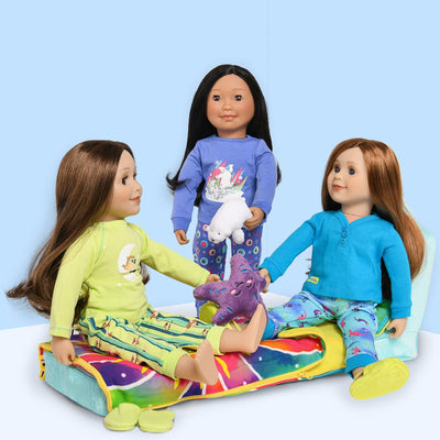 three dolls are having  pajama party on the Maplelea Slumber Lounge Fold-out bed