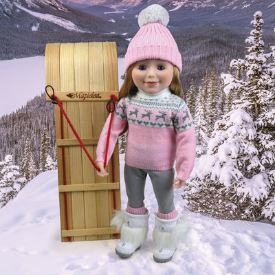 18 inch doll with toboggan and winter sweater set and furry white winter boots.
