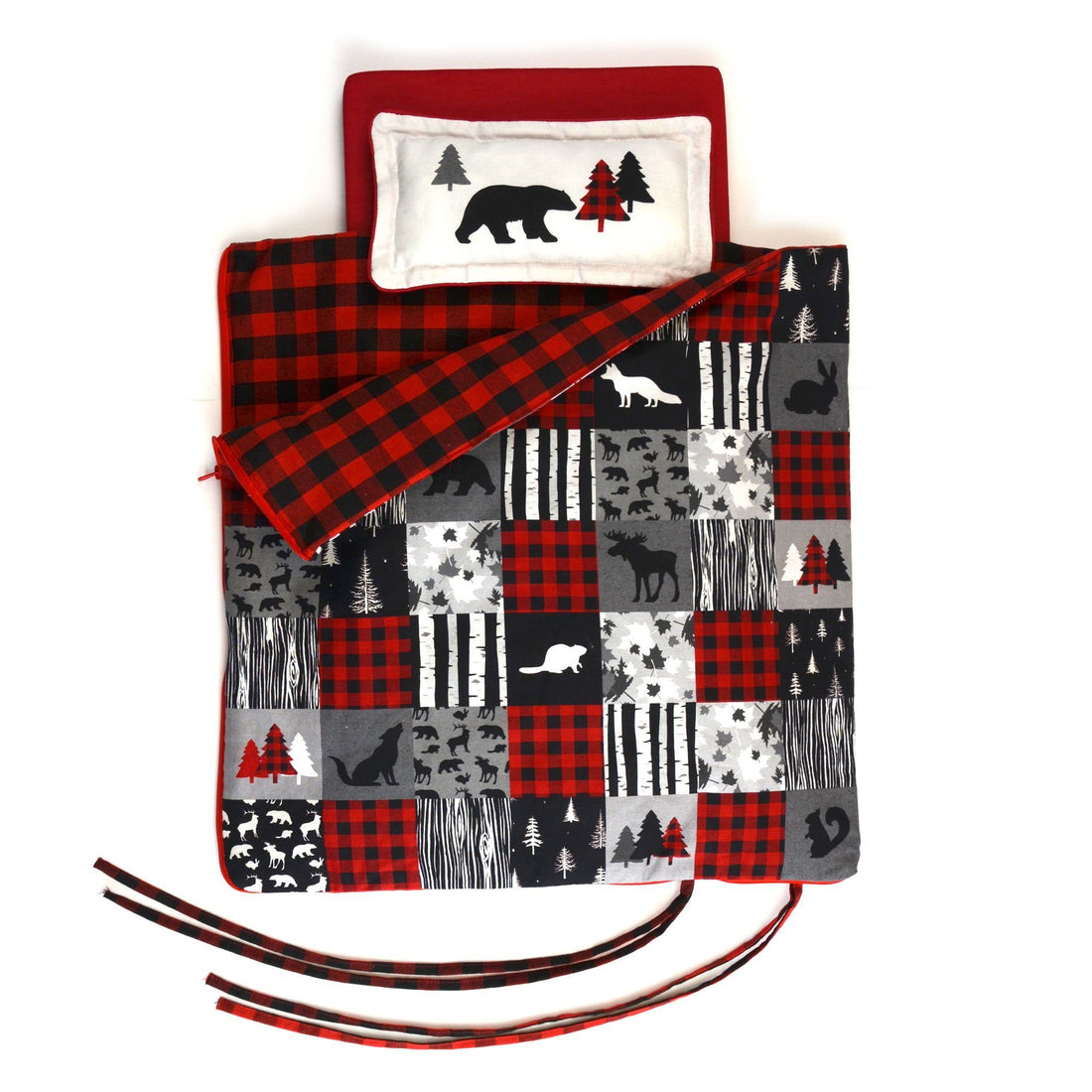 Red and black buffalo plaid patchwork style comforter features woodland creatures silhouettes and black and grey details also doubles as a sleeping bag for 18" dolls 